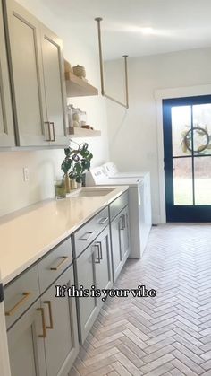 the kitchen is clean and ready to be used as a washer and dryer