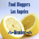 a lemon cut in half with the words food bloggers los angeles written below it