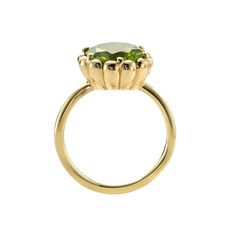 A vivid green peridot. This gem displays glorious chartreuse tone and is set in scalloped bezel on a minimalist band. The ring showcases the glorious  beauty of this magical stone, which happens to be the first gemstone to be discovered on Mars! It is a round flower-cut, measuring 10mm in diameter and is custom cut for Timeless Green Jewelry With Bezel Setting, Elegant Green Birthstone Ring With Bezel Setting, Timeless Green Round Band Jewelry, Luxury Green Rings With Bezel Setting, Luxury Green Ring With Bezel Setting, Green Peridot Birthstone Ring With Prong Setting, Green Gemstone Diamond Ring With Round Band, Timeless Green Diamond Round Ring, Peridot Center Stone Jewelry For May Birthstone