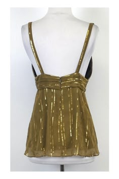 The Milly collection epitomizes bold & advanced contemporary fashion with a graceful edge. Milly designs can be found around the globe and have grown increasingly popular over the years for their luxurious fabrics and creative style. This gold silk spaghetti strap top is light & silky. Breathable fabric keeps you cool during warmer days. Wear it with your favorite shorts or skirt. Size 6 Body 85% Silk 15% Metallic Lining 100% Polyester Concealed back zip Plunge neckline Spaghetti strap Shoulder Silk Spaghetti Strap Top, Spaghetti Strap Top, Muslimah Fashion Outfits, Gold Silk, Gold Top, Muslimah Fashion, Strap Top, Party Tops, Strap Tops