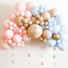 balloons and confetti are arranged in the shape of a cloud with words on them