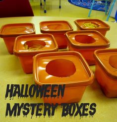 halloween mystery boxes on a table with the words, halloween mystery boxes written above them