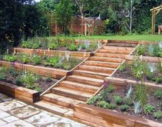 a garden with wooden steps leading up to it