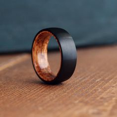 a wooden ring sitting on top of a wooden table