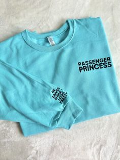 Let everyone know you're a passenger princess with this super cute trending shirt! Handmade in USA with embroidered stitching. Material: 50/50 Cotton, Poly Blend Slight Stretch Elastic/Knit Trim Fit:  Both sweatshirts and T-Shirts are Unisex Care: Machine wash cold. Tumble Dry Low Trendy Embroidered Long Sleeve T-shirt, Trendy Long Sleeve Embroidered T-shirt, Trendy Long Sleeve T-shirt With Embroidered Graphics, Trendy Long Sleeve T-shirt With Embroidered Text, Trendy Long Sleeve T-shirt With Embroidered Logo, Passenger Princess Pictures, Long Sleeve T-shirt With Embroidered Text, Passenger Princess Car Sticker, Princess Passenger