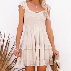 Shop eyecandybeach's closet or find the perfect look from millions of stylists. Fast shipping and buyer protection. This apricot colored babydoll dress features a fitted smock top with cap sleeves and a layered ruffle mini length skirt. Cute Tiered Ruffle Sundress, Cute Tiered Ruffled Sundress, Cute Tiered Dress With Smocked Back, Cute Tiered Sundress With Ruffle Hem, Cute Ruffle Dress With Ruffle Hem For Beach, Cute Ruffle Hem Dress For Beach, Cute Ruffle Hem Dress For The Beach, Non-stretch Ruffled Dresses For Day Out, Solid Ruffled Mini Sundress