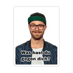 a man wearing glasses and a hat with the words was hast du gegen dich?