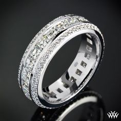 an image of a wedding ring with diamonds on the inside and in the outside,