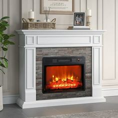 a white fireplace with an electric fire in it