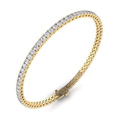 Our medium diamond tennis bracelet, set in 14K gold with our 4-prong setting, is a classic look that can be worn with multiple bracelets or elegantly alone. Set with 2.3-2.9 plus carats of round, brilliant-cut white diamonds, this bracelet is a welcome addition to your everyday. 14K or 18K gold 3 ct diamonds for 7 inch length and up (ct diamonds vary upon length) G-I color diamonds (all colors and grades available upon request) Diamond color is G-H Diamond clarity is SI1-SI2 Secure insert clasp with safety link for safety, diamonds continuous on clasp Available in Yellow Gold, Rose Gold and White Gold Made with love in Los Angeles Complimentary gift wrapping provided 2.4-3.2 plus carats depending upon length of the bracelet. Each bracelet varies slightly in terms of carat weight.