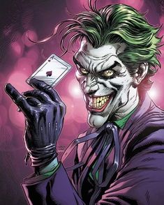 the joker is holding up a card in his hand