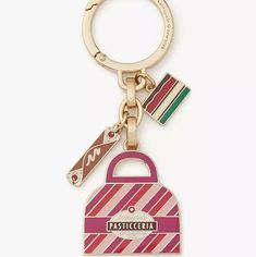 This Clever Keychain By Kate Spade New York Will Put An End To The Never-Ending Scramble Of Trying To Find Your Keys In Your Bag. How Good Is That? Sweet! Or Use As A Stunning Bag Charm. You Decide. Details: Colors Are Cream, Rasberry, Red Measures 1.66"H X 1.55"W X 0.88"D Keyring Closure Engraved Logo Materials Goldtone Metal Brand New With Tag **(Perfect Mother's Day Gift!) Pink Bag Charm Keychain For Everyday Use, Trendy Pink Travel Keychain, Kate Spade Pink Bag For Gift, Pink Kate Spade Bag As A Gift, Pink Kate Spade Bag As Gift, Pastry Bag, Charm Keychain, Kate Spade Accessories, Engraved Logo