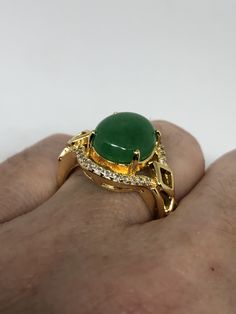 Vintage Lucky Green Nephrite Jade Golden ring Large green nephrite jade Gold finished German Silver Vintage ring, does not tarnish, NOT sterling Size 7, 8, or 9 All rings are shipped free in the US in a nice gift box. Check out our over a THOUSAND great reviews Engraving is $4 per letter and is not always perfect depending on the piece. It can take a few days if the jeweler is busy. This is payable to Paypal Judithsltd@gmail.com Green Cabochon Round Stone Rings, Green Crystal Gemstone Ring, Green Gemstone Crystal Ring, Green Crystal Gemstone Ring For Spiritual Wear, Green Emerald Spiritual Ring For Anniversary, Green Emerald Ring For Anniversary, Spiritual Green Open Ring, Green Jade Spiritual Rings, Spiritual Jade Gemstone Rings