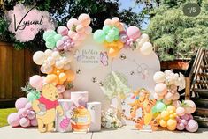 winnie the pooh birthday party with balloons and decorations