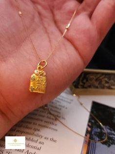 Gift yourself or your love once this   Pure Gold Auspicious Necklace. Crafted with pure 24 Karat Pendant gold and 18K Gold Chain. *Material: 24 K Pure Gold Pendant/18K Chain *Pendant Length: Approximately 17.7mm (w/hook) , 14.3mm (w/o hook) *Pendant Width: Approximately 9.1mm *24K Pendant Weight: Approximately 1g *18K Chain Weight: Approximately 1.30g ;  *18K Chain Leng5h: Approximately 18 Inches  *18K Chain Width: Approximately .5mm 🍁HALLMARKED. NOT GOLD FILLED. NOT GOLD PLATED. NOT GOLD VERME Gold Amulet Necklace For Good Luck, Gold Nameplate Necklace With Charms, Gold Pendant Necklace For Good Luck, Gold Plated Necklaces For Blessing Occasions, Traditional Gold Necklaces With Charms, Traditional Gold Necklace With Charms, Spiritual Gold Charm Necklace For Good Luck, Gold Necklaces With Charms And Square Pendant, Gold Engraved Charm Necklace For Good Luck