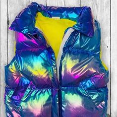 Darling Girls Metallic Puffer Vest Is Just Perfect For The Cooler Months. High Collar, Padded Body And Pockets Will Keep Her Toasty Warm. Zipper Front Closure, Polyester/Cotton Blend. Sold By Lassies And Laddies. Xs (4-5): 15 W X 15 L Multicolor Spring Outerwear For School, Spring Multicolor School Outerwear, Cute Blue Fitted Outerwear, Blue Fitted Cute Outerwear, Patagonia Puffer Jacket, Girls Puffer Jacket, Fur Hood Jacket, Toddler Jacket, Pink Belt