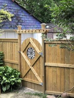 a wooden gate with a clock on it