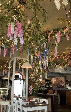 flowers hanging from the ceiling in a restaurant