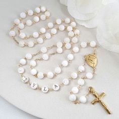 This Personalized Rosary, is ideal as a Baptism gift for a little girl or baby boy or as a gift for a special occasion. It is expertly handcrafted in a traditional style with a contemporary twist utilizing genuine Mother of pearl stone and gold-plated brass wire, which not only gives a touch of nature but also tenderness. The letter beads on the Rosary are also handmade from genuine mother of pearl, and the length is perfect to worn as a dainty Rosary necklace for women. *MATCHING ROSARY BRACELE White Jewelry For Confirmation On Mother's Day, White 8mm Beads Jewelry As Gift, White Jewelry With 8mm Beads As Gift, Personalized White Cross Jewelry, White Jewelry With 8mm Beads For Gift, White Spiritual Jewelry With Custom Name, Spiritual White Necklace For Mother's Day, White Jewelry With 8mm Beads For Mother's Day, Spiritual Jewelry With Round Beads For Confirmation