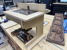 a workbench made out of plywood with tools on the table next to it