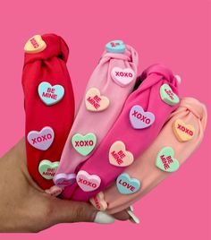 Adorable Valentine's Conversation Heart Headbands!  ♥️🧡 ☆ These knotted conversation heart headbands are SO super cute, trendy, and stylish hair accessories to complement almost any outfit this season.  Embellished with the cutest conversation hearts-- these Valentine's Day headband is sure to turn heads!  ☆ Available in 8 GORGEOUS colors ☆ 1. hot pink  2. cotton candy pink  3. cherry red  4. flamingo  5. Raspberry  6. white  7. lilac  8. soft pink   ☆ Size 2 years-adults   ☆ FASHION TIP: Wear this headband with one of our super soft crewnecks, custom patch jackets, or Valentines Sunnies to add a little sparkle to your cozy + cute look.  💘Each item is made to order and will be ready to ship in 1-3 business days! (sometimes sooner) Make sure to follow me and check out all my other adorabl Valentines Headband, Heart Headband, Conversation Heart, Girls Headband, Conversation Hearts, Candy Hearts, Heart Fashion, Knotted Headband, Converse With Heart