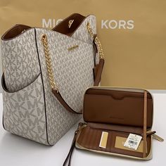 Michael Kors Large X Chain Shoulder Tote & Lg Flat Multifunctional Phone Case-Wristlet-Wallet Jet Set Large Logo Shoulder Bag Shoulder Bag Vanilla Signature Logo-Print Canvas 89.4% Coated Canvas/9.6% Polyester/1% Polyurethane Gold-Tone Hardware 15.6”W X 11”H X 5.5”D Handle Drop: 10" Exterior Details: Front Slip Pocket Interior Details: Back Zip Pocket, 2 Back Slip Pockets Lining: 100% Polyester Zip Fastening Imported & Lg Flat Multifunctional Phone Case Material: Leather/Pvc Removable Leather Wrist Strap Zip Around Closure Gold Tone Hardware Vanilla Signature Color Interior Cell Phone Pocket, Id Window, 6 Card Sl Michael Kors Tote Bag, Michael Kors Tote Bags, Exterior Details, Michael Kors Shoulder Bag, Travel Tote Bag, Michael Kors Purse, Fancy Bags, Black Leather Purse, Black Leather Handbags