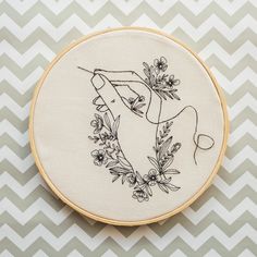 a hand embroidery pattern with flowers on it