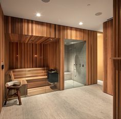 a bathroom with wooden walls and flooring