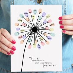 a woman holding up a card with a dandelion on it that says, teachers plant seeds that grow