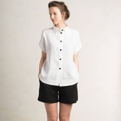 "Beautiful loose fit linen women's shirt with short sleeves. Composition: 100% linen Closure: black buttons SIZE CHART: *Loose fit XS/S bust - 27.5\"-35.5\" / 70-90cm waist - 21.5\"-31.5\" / 55-80cm hips - 31.5\"-47\" / 80-120cm height - 61\"-66\" / 155-168cm *Loose fit S/M bust - 31.5\"-39.5\" / 80-100cm waist - 23.5\"-35.5\" / 60-90cm hips - 35.5\"-51\" / 90-130cm height - 64.5\"-70\" / 164-178cm *Loose fit M/L bust - 35.5\"-51\" / 90-130cm waist - 31.5\"-43.5\" / 80-110cm hips - 39.5\"-55\" / Woman White Shirt, White Linen Top, Linen Shirts Women, White Linen Shirt, White Shirts Women, Top Summer, Shirt Short Sleeve, Linen Top, Linen Women