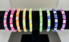 An assortment of bright and colorful heishi stretch bracelets in fun summer colors. Bracelets are all 7". Multicolor Stackable Stretch Bracelet For Beach, Heishi Bracelets, Clay Bracelets, Clay Bracelet, Clay Bead, Bead Pattern, Summer Bracelets, Pattern Ideas, Fun Summer