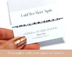 a person holding a business card with gold foil on it and the words, personalize with your name or word's