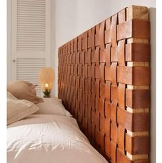 the headboard is made out of wood blocks