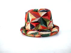 This Geometric Bucket hat is perfect for Festivals. This solid Bucket hat features a Jamaican Rasta Inspired , Red green yellow color bucket hat. Rock this hat as you dance the night away at your next outdoor concert or event. Fashionable and a must-have . This Hat is unisex that looks great on both men and women . This Hat is very durable and can be used as a special gift . -One Size Fits Most -Perfect for Festivals Color : Red green yellow Color : Rasta Bucket Hat / Reggae Hat / Jamaican Hat C Multicolor Curved Brim Fedora For Festivals, Multicolor Short Brim Hat, Adjustable Multicolor Wide Brim Cloche Hat, Multicolor Short Brim Hat, One Size Fits Most, Retro Multicolor Short Brim Hat, Handmade Multicolor Brimmed Fedora, Unique Adjustable Multicolor Hats, Multicolor Short Brim Mini Hat, Unique Multicolor Wide Brim Hat