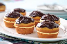 chocolate frosted cupcakes on a white plate