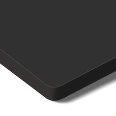 a black computer mouse pad on a white surface