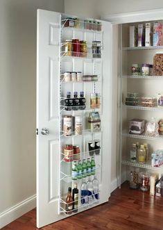 the pantry door is open to reveal an organized pantry