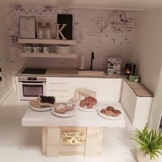 a model kitchen is shown with cookies on the counter