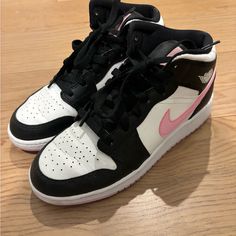 Black And White Air Jordan Sneakers With Pink Nike Swoosh And Pink Soles. Good Condition, Worn Less Than 5 Times. Size 5.5y/7w Pink High-top Sneakers With Contrast Sole And Round Toe, Pink High-top Sneakers With Contrast Sole, Pink Mid-top Custom Sneakers With Contrast Sole, Nike Pink High-top Jordan Shoes, Nike Pink High-top Sneakers With Boost Midsole, Nike Pink High-top Sneakers With Laces, Pink Nike High-top Sneakers With Laces, Pink Mid-top Skate Shoes With Boost Midsole, Nike Low-top Pink Jordan Shoes