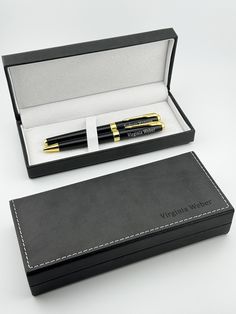 a black box with a pen in it