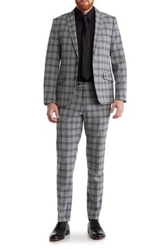 Update your officewear wardrobe with this peaked-lapel suit patterned with a bold plaid print. Blazer has 31" length (size 40R); pants have 32" inseam; 13" front rise (size 34W) Blazer has peaked lapels; four buttons on each cuff; two-button closure; chest welt pocket; front flap pockets Pants have zip fly with hook-and-bar closure; front slant pockets; back welt pockets Lined 69% polyester, 29% rayon, 2% spandex Dry clean Imported Model stats: 6'0" height; 32" waist. Model is wearing size 40R. Plaid Suit With Suit Collar For Work, Fitted Houndstooth Business Casual Suits, Fitted Houndstooth Suit For Business Casual, Tailored Plaid Suits For Business Casual, Plaid Notch Lapel Suit For Business Casual, Plaid Single Breasted Suits For Business Casual, Tailored Single Breasted Dress Pants For Business Casual, Business Casual Suits With Houndstooth Pattern And Notch Lapel, Business Casual Houndstooth Suit With Notch Lapel