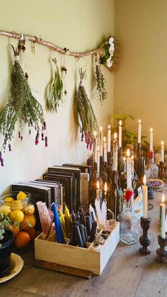 a table with candles and fruit on it