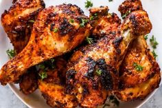 grilled chicken wings on a plate with parsley