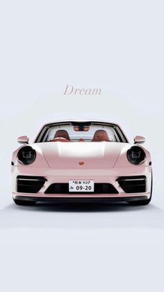 a pink porsche sports car with the words dream above it