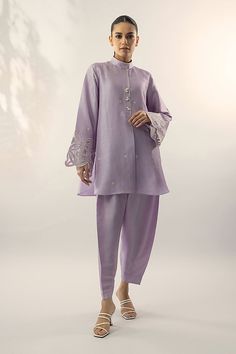 A refreshing lilac shade on a raw silk kurta, is adorned with embroidery on the sleeves and pearl buttons. Pair it with a co-ord trouser. Classy, elegant and summer ready. Indian Co Ord Set Casual, Silk Wedding Sets With Set-in Sleeves, Sania Maskatiya Casual, Elegant Designer Pant Set With Dabka Detailing, Elegant Pant Set With Dabka For Designer Wear, Elegant Designer Chikankari Embroidery Pant Set, Elegant Designer Pant Set With Chikankari Embroidery, Elegant Chikankari Embroidered Pant Set, Elegant Pant Set With Resham Embroidery For Eid