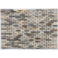 a wall made out of wooden planks on top of a tile floor with white walls