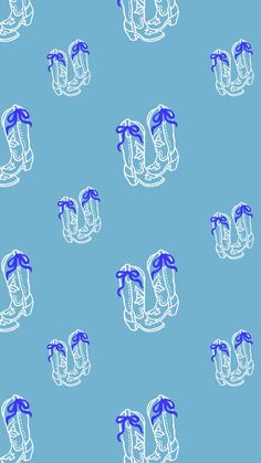 blue and white cowboy boots on a blue background