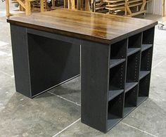 a wooden table sitting on top of a tiled floor