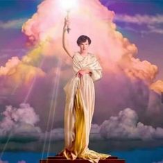 a painting of a woman holding a light up in the air with clouds behind her