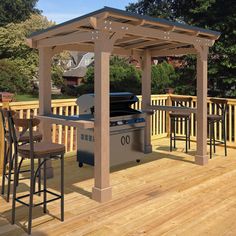 an outdoor grill area on a deck with bar stools and table in the foreground